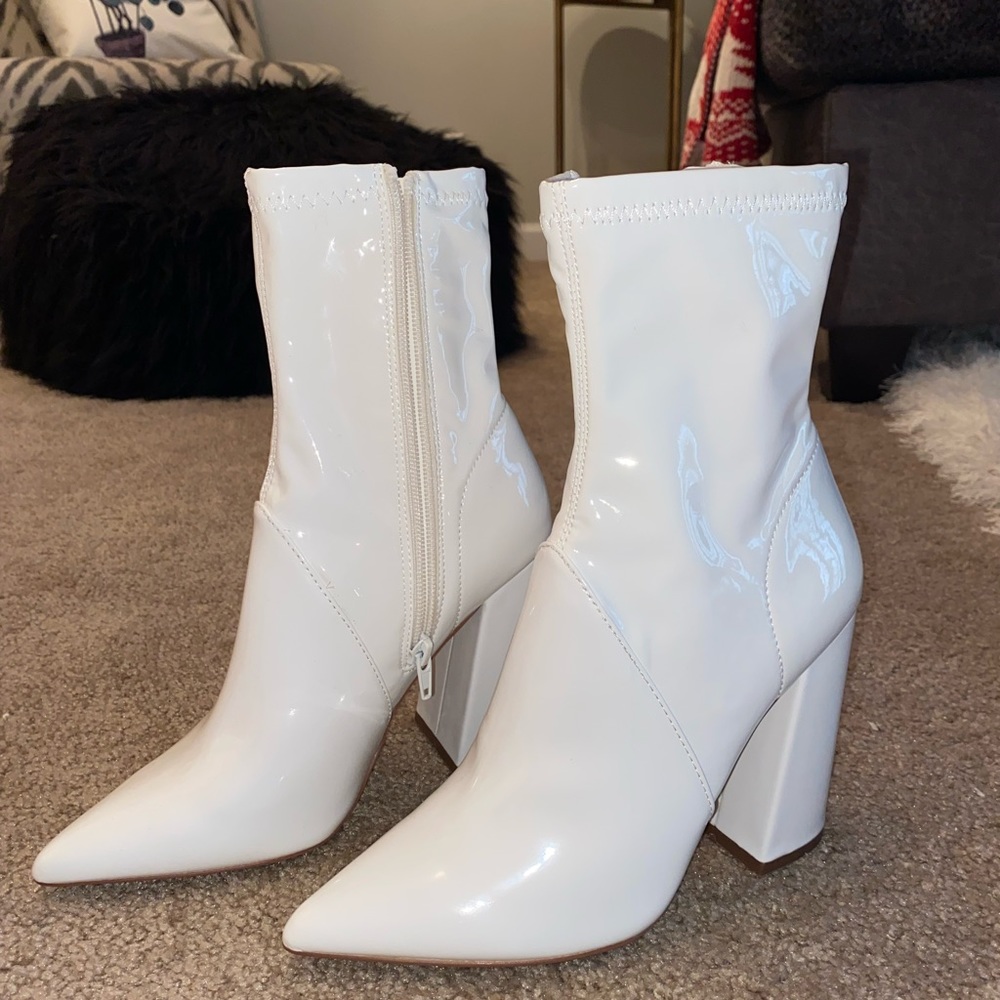 Selling white Steve Madden booties, never worn. Brand new! Bought October 2021.